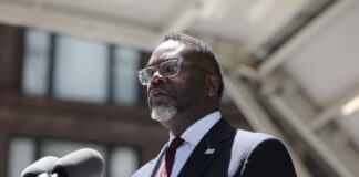 Chicago Mayor Brandon Johnson speaking at a Memorial Day event.