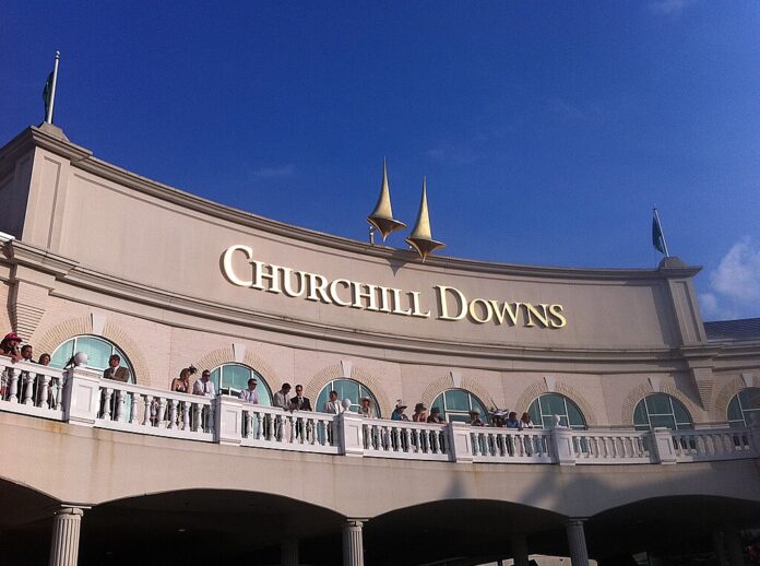 Churchill Downs Q3 2025: Record Revenue Up 9% Despite Impairment Churchill Downs racetrack building exterior under clear blue sky.