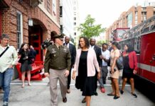 Washington D.C. Mayor Muriel Bowser walking outside with officials during a public appearance.