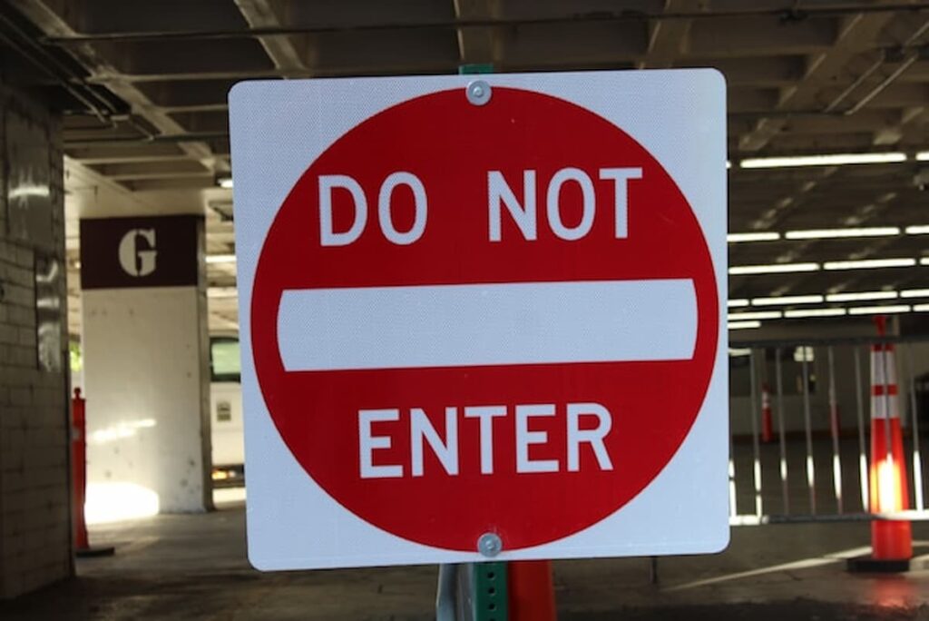 Red and white “Do Not Enter” traffic sign in a parking structure