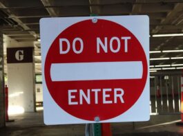 Washington & Louisiana Become Latest States Opposing Prediction Markets Red and white “Do Not Enter” traffic sign in a parking structure