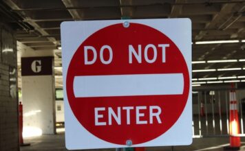 Washington & Louisiana Become Latest States Opposing Prediction Markets Red and white “Do Not Enter” traffic sign in a parking structure