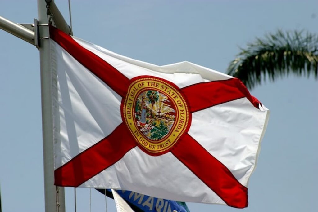 Florida state flag waving against a clear sky