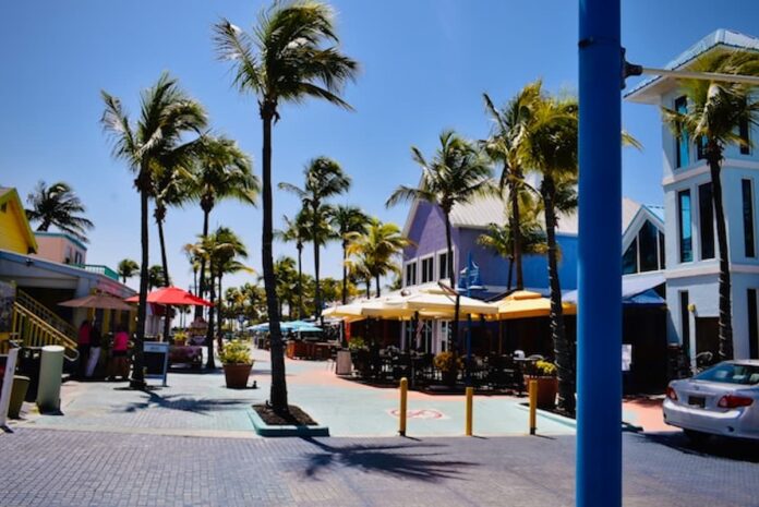 Colorful restaurants and palm trees in Fort Myers, Florida, on a sunny day