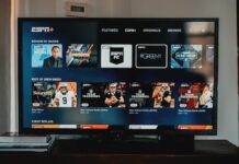 Television screen displaying ESPN Plus interface in a living room.