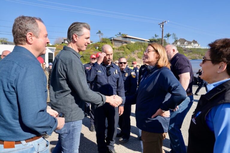 FEMA Administrator Deanne Criswell shakes hands with California Governor Gavin Newsom during a disaster response visit