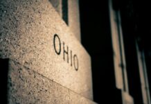 Legal Online Casinos in Ohio Unlikely Anytime Soon Close-up of a granite monument engraved with the word “Ohio.”