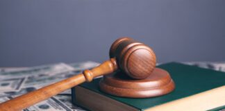 Could Texas AG Be Next to Crack Down on Sweepstakes Casinos? Judge’s gavel resting on a law book and cash.