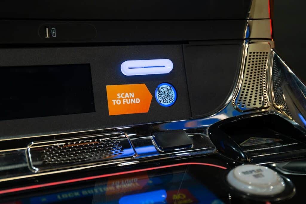 Casino slot machine with Trustly Scan & Pay QR code for cashless funding.