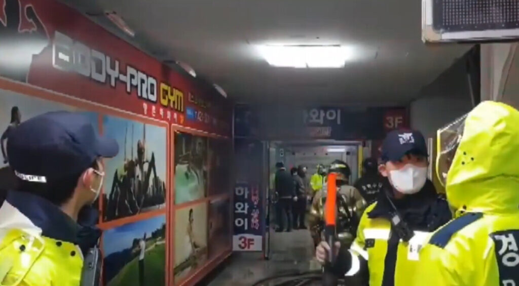 Police at the scene of a 2019 fire in the Daebo Apartment complex in Daegu, South Korea.