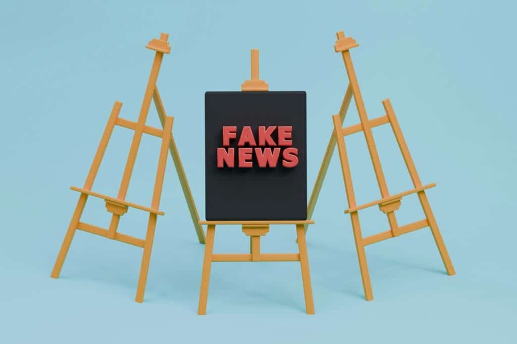 A rendered image of an easel with Fake News written on it