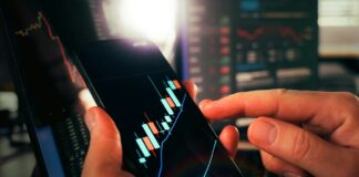 South Korean Casino Stocks Continue to ‘Soar’ as Room Occupancy Rates Hit 90% Stock chart on phone