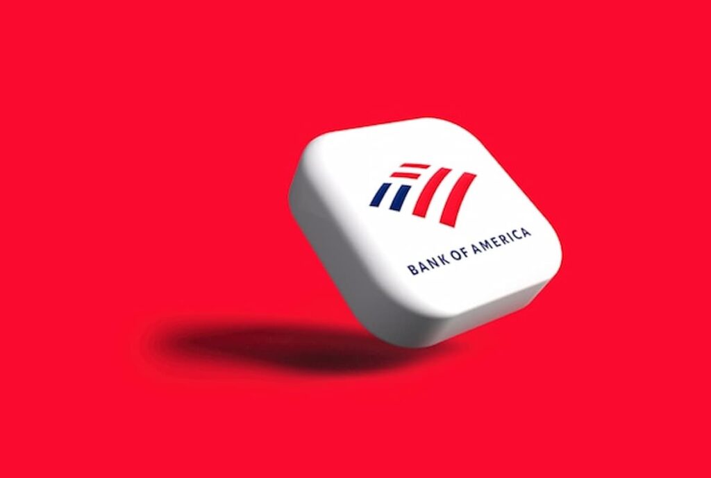 A white rounded square displaying the Bank of America logo floats against a solid red background, casting a soft shadow.