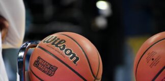 NCAA Reverses Pro-Sports Betting Rule Change, Keeps Full Gambling Ban Intact Close-up of a basketball resting on a metal rack