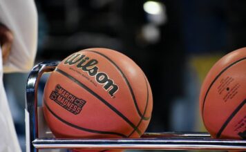 NCAA Asks Kalshi to Remove ‘March Madness’ Trademark From Its Markets Close-up of a basketball resting on a metal rack