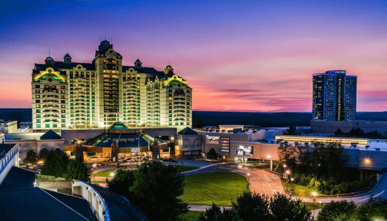 Foxwoods Resort Casino at sunset with the Grand Pequot Tower and Fox Tower illuminated.