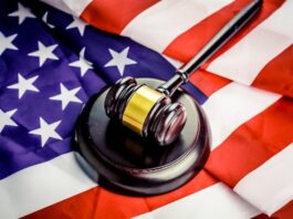 Nevada Judge Reverses Course, Dissolves Kalshi Injunction as State Issues Industry Warning A judge’s gavel resting on an American flag.