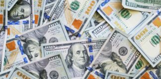 A pile of $100 US dollar bills