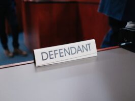 Kalshi Wins Federal Court Battle Against California Tribes Over Sports Event Contracts Defendant nameplate on courtroom table.