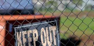 Maryland Sends Second Round of Cease-and-Desist Letters to Chumba & LuckyLand Slots Keep Out sign hanging on a chain-link fence
