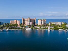 Lee County Raids Net 134 Slot Machines, $22K Amid Florida’s Arcade Crackdown Aerial view of the Lee County waterfront with marinas and high-rise buildings along the Gulf Coast of Florida.