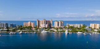 Aerial view of the Lee County waterfront with marinas and high-rise buildings along the Gulf Coast of Florida.