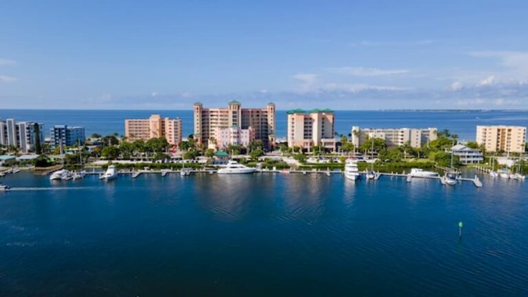Aerial view of the Lee County waterfront with marinas and high-rise buildings along the Gulf Coast of Florida.