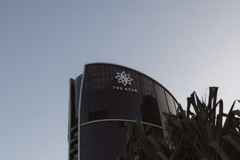 Glass tower building at dusk with a clear sky above