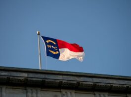 Underdog Sportsbook Shuttering in North Carolina Amid Move to Prediction Markets North Carolina state flag waving against a clear blue sky