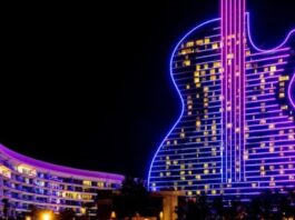 Florida Judge Dismisses Challenge to Seminole Tribe’s Sports Betting Compact Seminole Hard Rock Hotel & Casino guitar-shaped tower illuminated at night in Florida