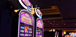 Norfolk’s First Casino Opens After Years of Delay Row of illuminated slot machines inside a casino.
