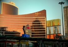 Wynn Macau exterior reflecting golden light at sunset.