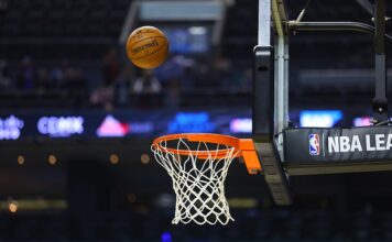 Milliseconds Matter: Why Inside Information is Sports Betting’s Biggest Vulnerability A basketball approaches the rim during an NBA game.