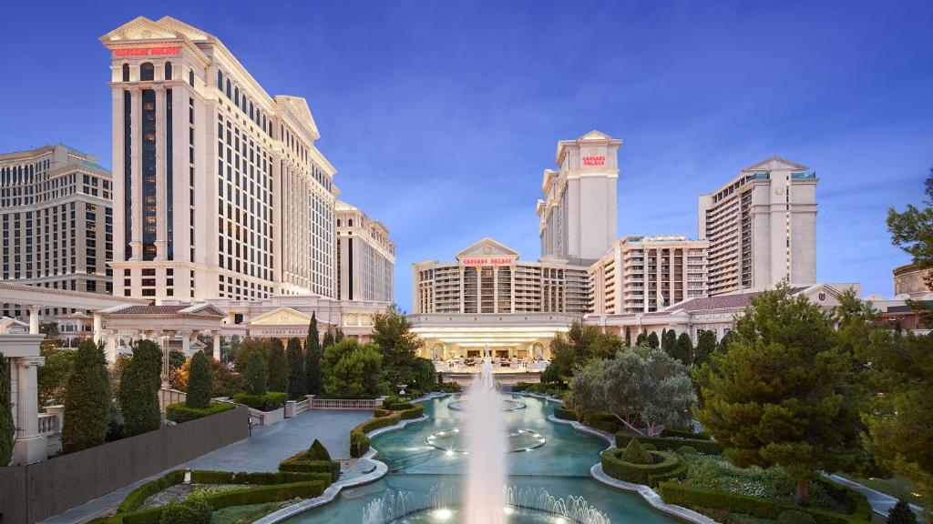 Grand exterior of Caesars Palace with landscaped fountains at the entrance