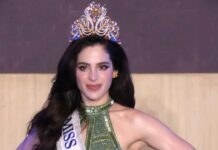 Miss Universe 2025, Fátima Bosch, wearing a green gown and crown during a coronation appearance.