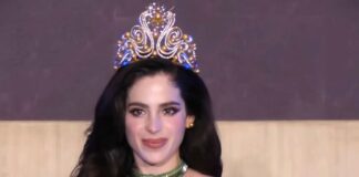 Miss Universe 2025, Fátima Bosch, wearing a green gown and crown during a coronation appearance.