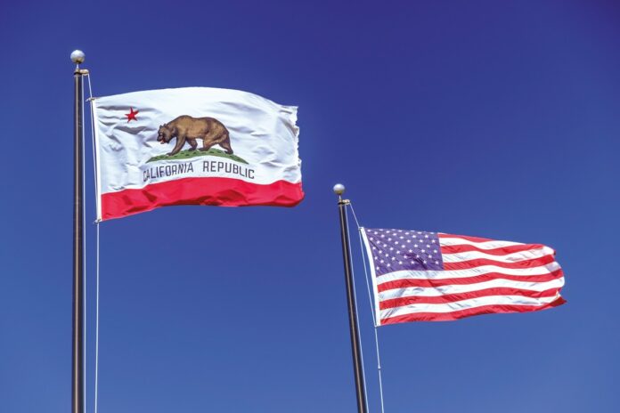 California and USA flags waving next to each other