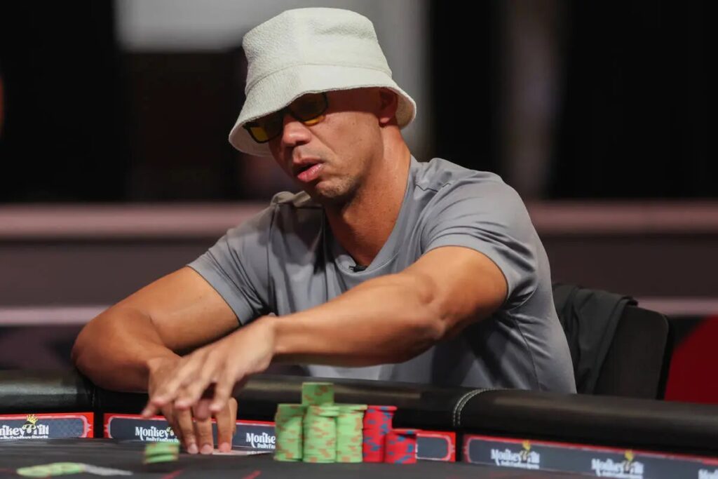 Phil Ivey, iconic poker legend and multiple WSOP bracelet winner, seated at a casino table during a high-stakes poker game