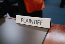 Close-up photo of a plaintiff sign on a table