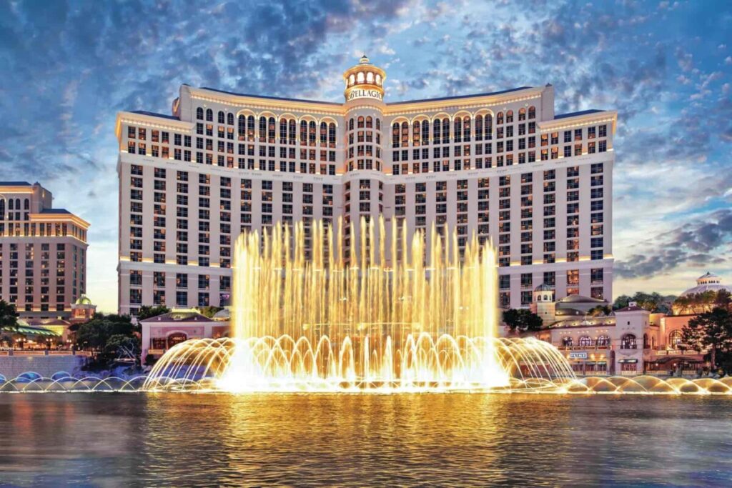 Iconic Bellagio Hotel with illuminated fountain show at dusk
