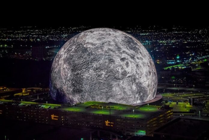 Sphere’s $200M 'Wizard of Oz' Run Defies Las Vegas' Tourism Slump A high-resolution aerial photo of the Las Vegas Sphere lit up as a massive moon, set against the city’s night skyline.