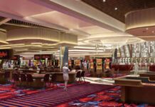 Interior rendering of Bally’s Chicago casino showing table games, slot machines, patterned carpeting, and decorative ceiling lighting across a large open gaming floor.