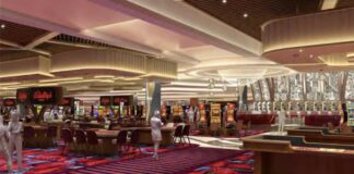 Bally’s Secures $1.1B Financing as New Chicago Casino Renderings Debut, Boosting New York Bid Interior rendering of Bally’s Chicago casino showing table games, slot machines, patterned carpeting, and decorative ceiling lighting across a large open gaming floor.