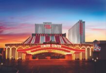 Exterior view of Circus Circus Las Vegas at dusk, showing the illuminated marquee and hotel towers