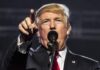 Trump Sidesteps Question on Eliminating Federal Tax on Gambling Winnings Donald Trump speaking at a rally, pointing forward while addressing the audience from behind a microphone.