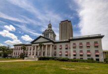 Old Florida State Capitol with red-and-white awnings and the modern Capitol tower in Tallahassee under a bright sky, representing new state gambling legislation.