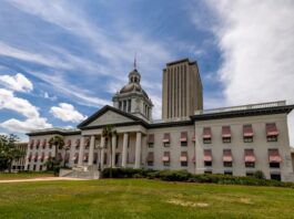 Florida Sweepstakes Casino Ban Set for Full House Vote Following Committee Approval Old Florida State Capitol with red-and-white awnings and the modern Capitol tower in Tallahassee under a bright sky, representing new state gambling legislation.