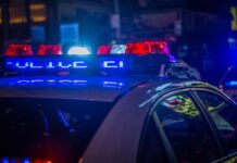 ICE, IRS, and Florida Regulators Seize Hundreds of Illegal Gambling Machines in Multi-County Bust Police vehicle with flashing red and blue lights during a nighttime law enforcement operation