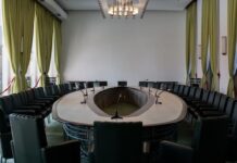 Empty conference room prepared for a regulatory meeting on gaming policy