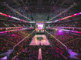 Most Americans Say Sports Betting Undermines Integrity of Games, NBC Poll Finds Fans fill a large indoor arena during a professional basketball game.